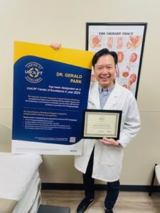 Dr. Gerald Park receiving his COE recognition. 